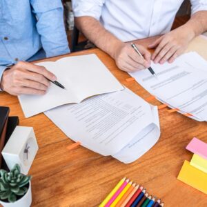 man looking at document with child
