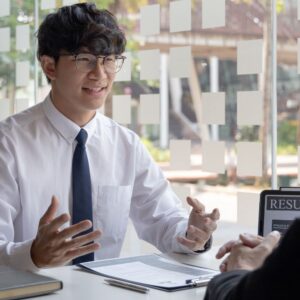 man being interviewed at a table