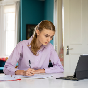 a lady studying on a laptop