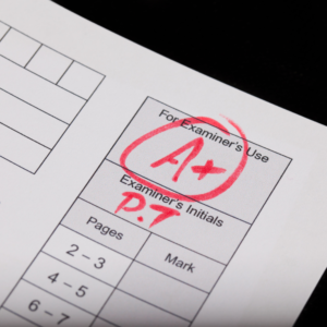 A piece of paper with a red A mark on it